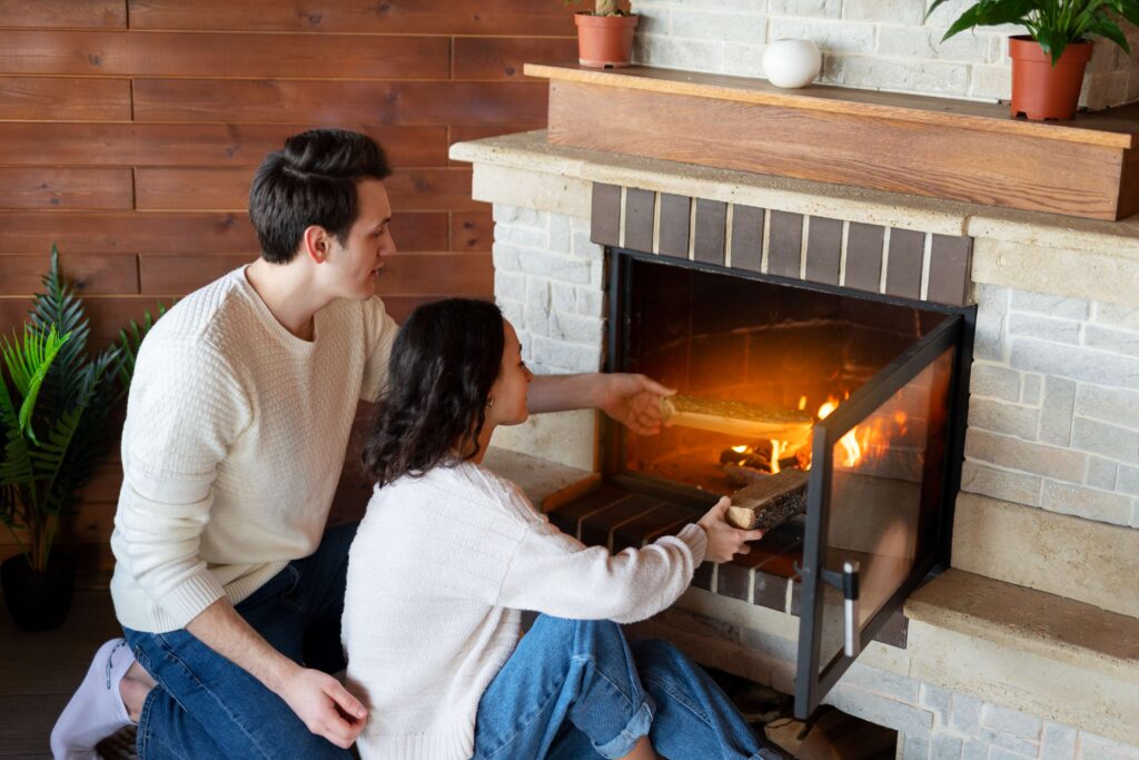 high-angle-people-sitting-by-fireplace